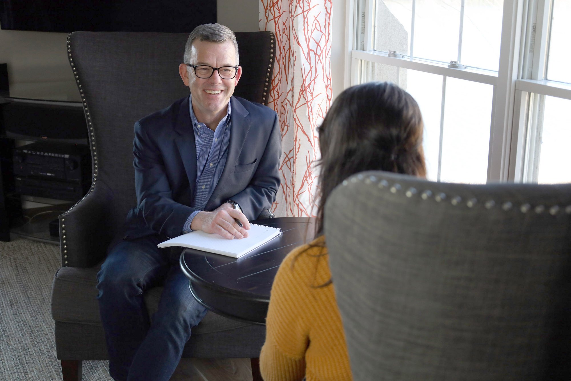 Two professionals talking at a table